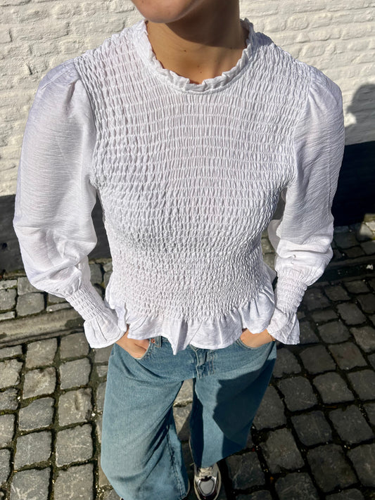 White ruffle blouse